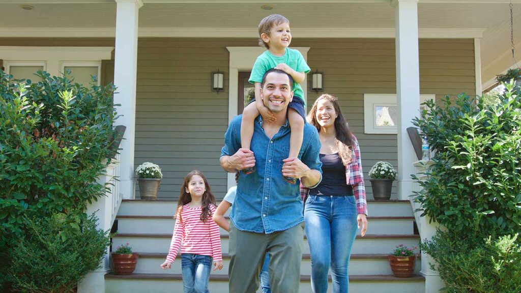 A happy family after their home was reconstructed after a fire damage.